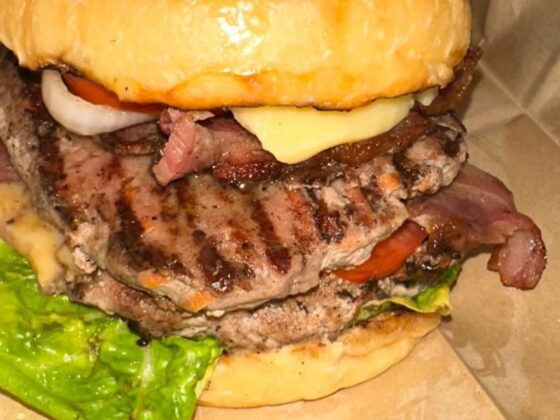 Savoring a Culinary Symphony: The Unforgettable New York Double Quarter Pounder Bacon Cheeseburger at Jonathan Peter Cafe & Lounge