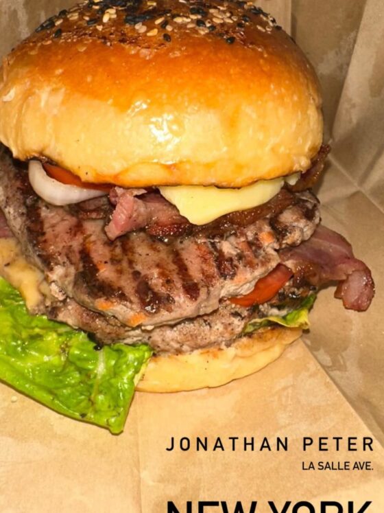 Savoring a Culinary Symphony: The Unforgettable New York Double Quarter Pounder Bacon Cheeseburger at Jonathan Peter Cafe & Lounge